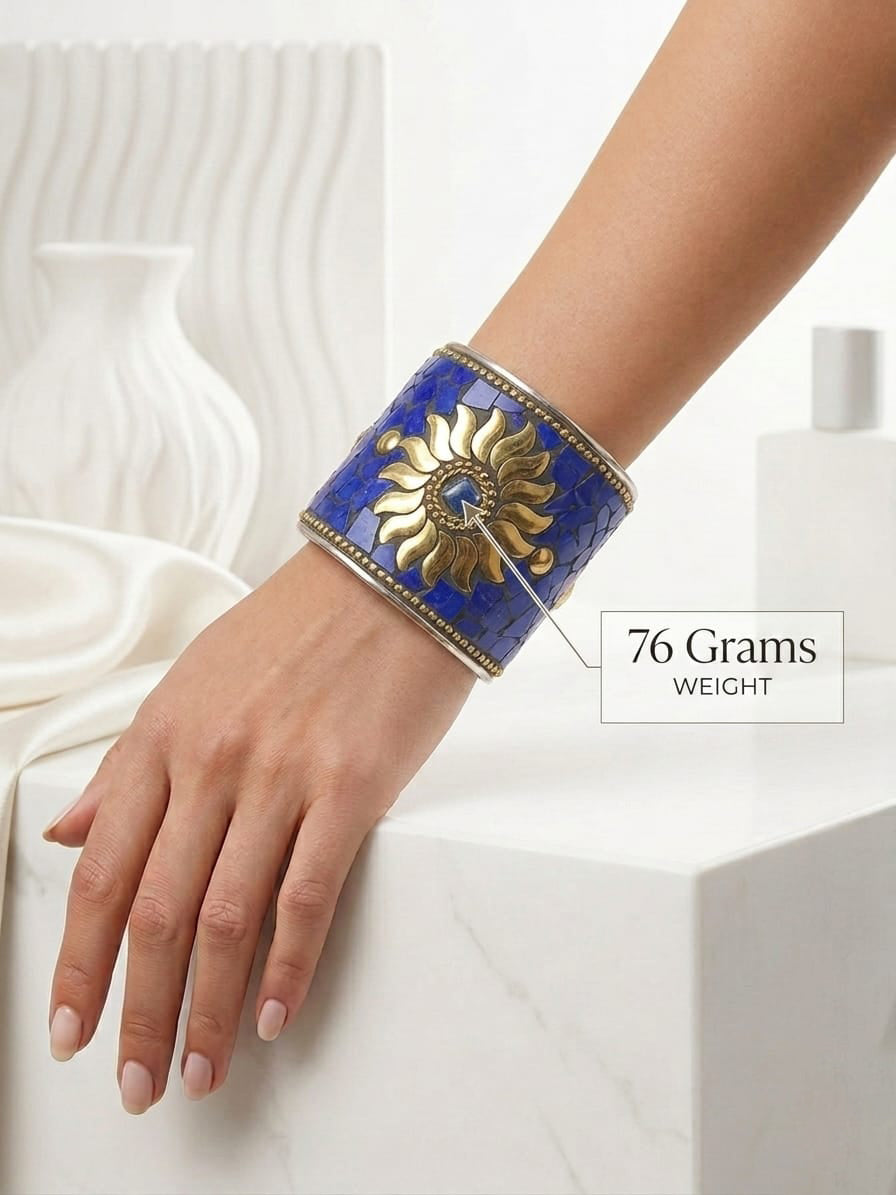 Handcrafted wide statement cuff jewelry weighing 76g, showcasing vibrant blue mosaic tiles and an antique brass-toned sun setting.