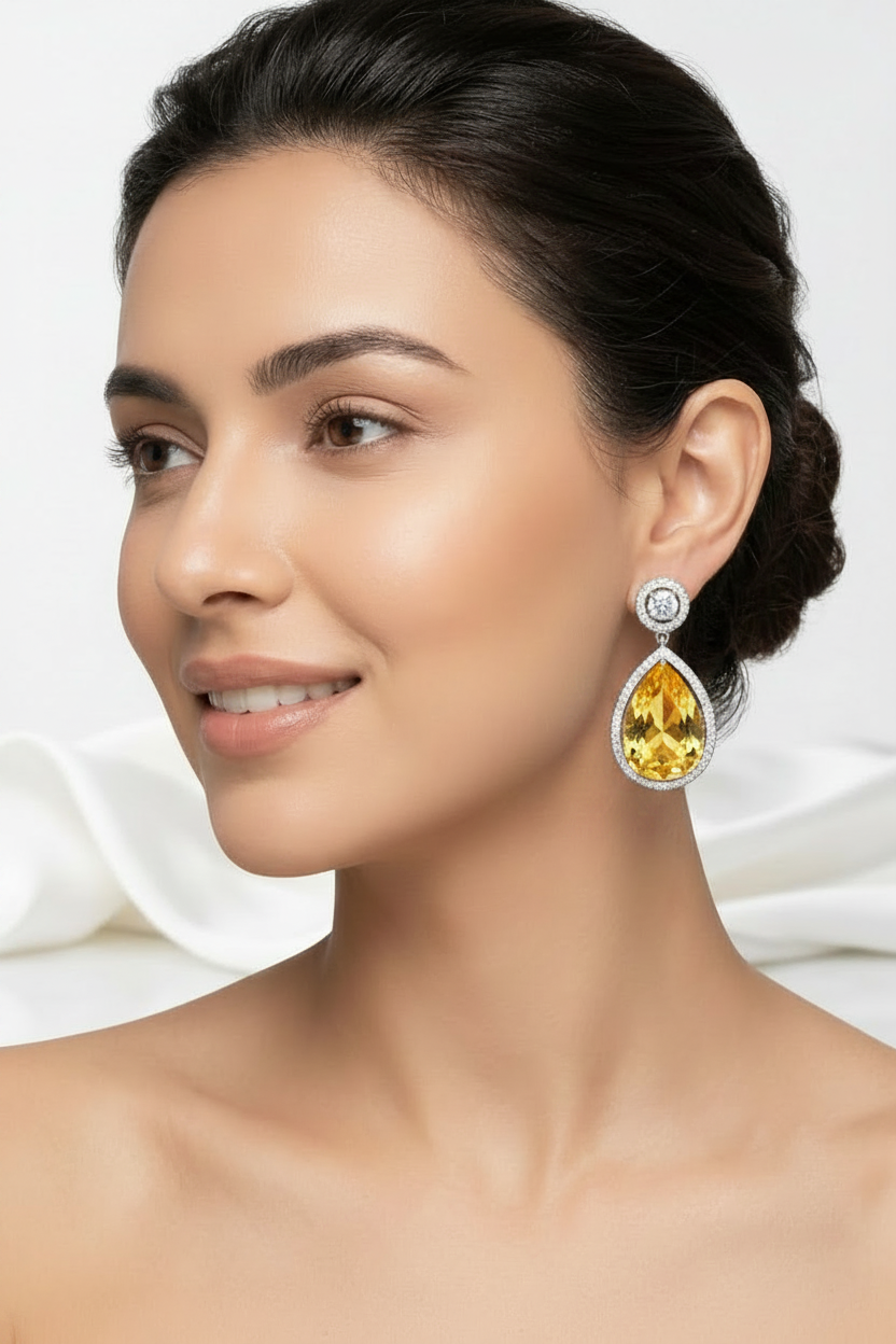Amethyst teardrop earrings with halo diamond-style setting, perfect for formal occasions.