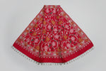 Rred pashmina scarf with Kashmiri embroidery in a floral pattern, featuring tassels on the ends.