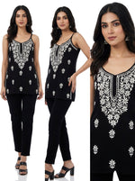 Short noodle top with hand made embroidered is being worn by models in different poses to show the full details of the kurti.