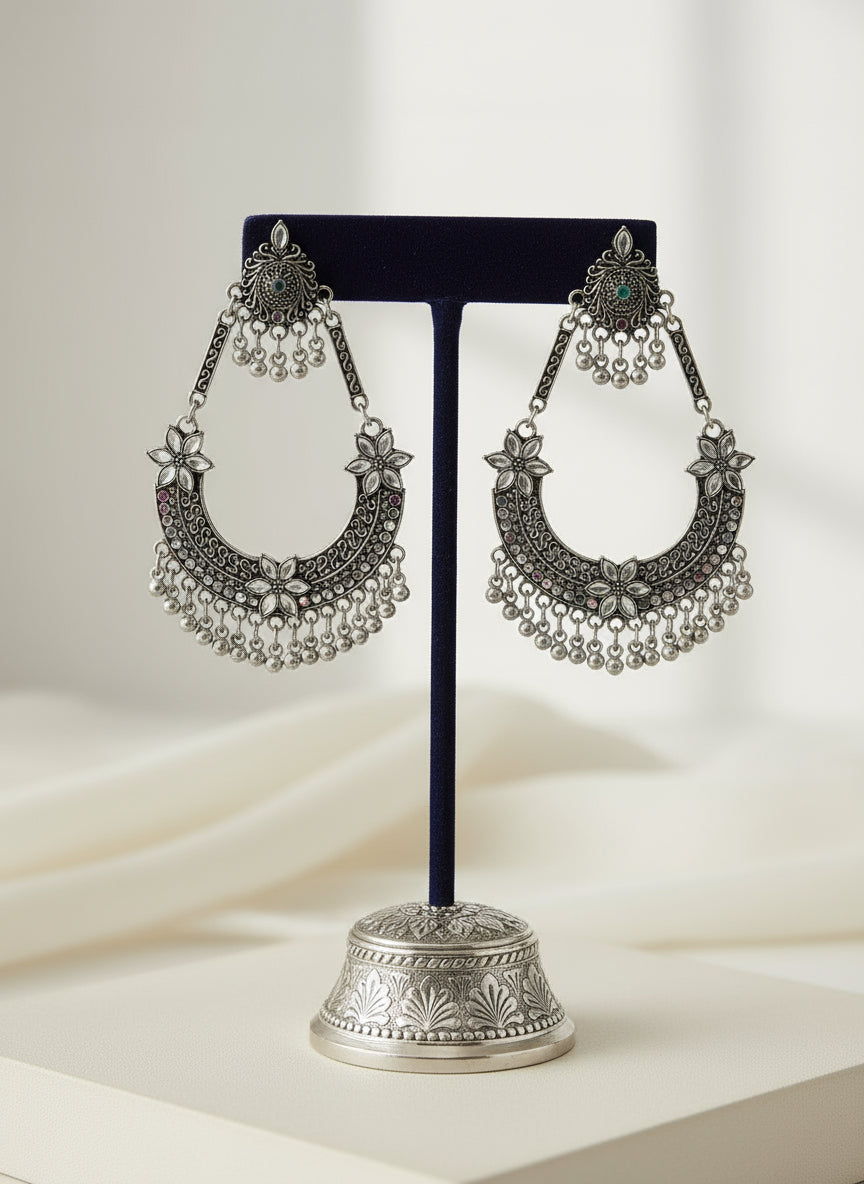 Silver ornate earring by famaza couture