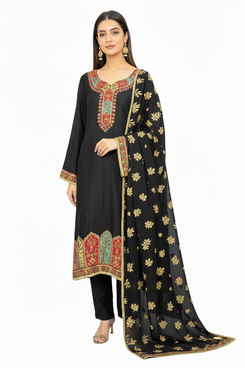 Model wearing a black silk kurta set with intricate Kanni embroidery and zari work, paired with a Banarasi chiffon dupatta and raw silk trousers, set against a pure white background.