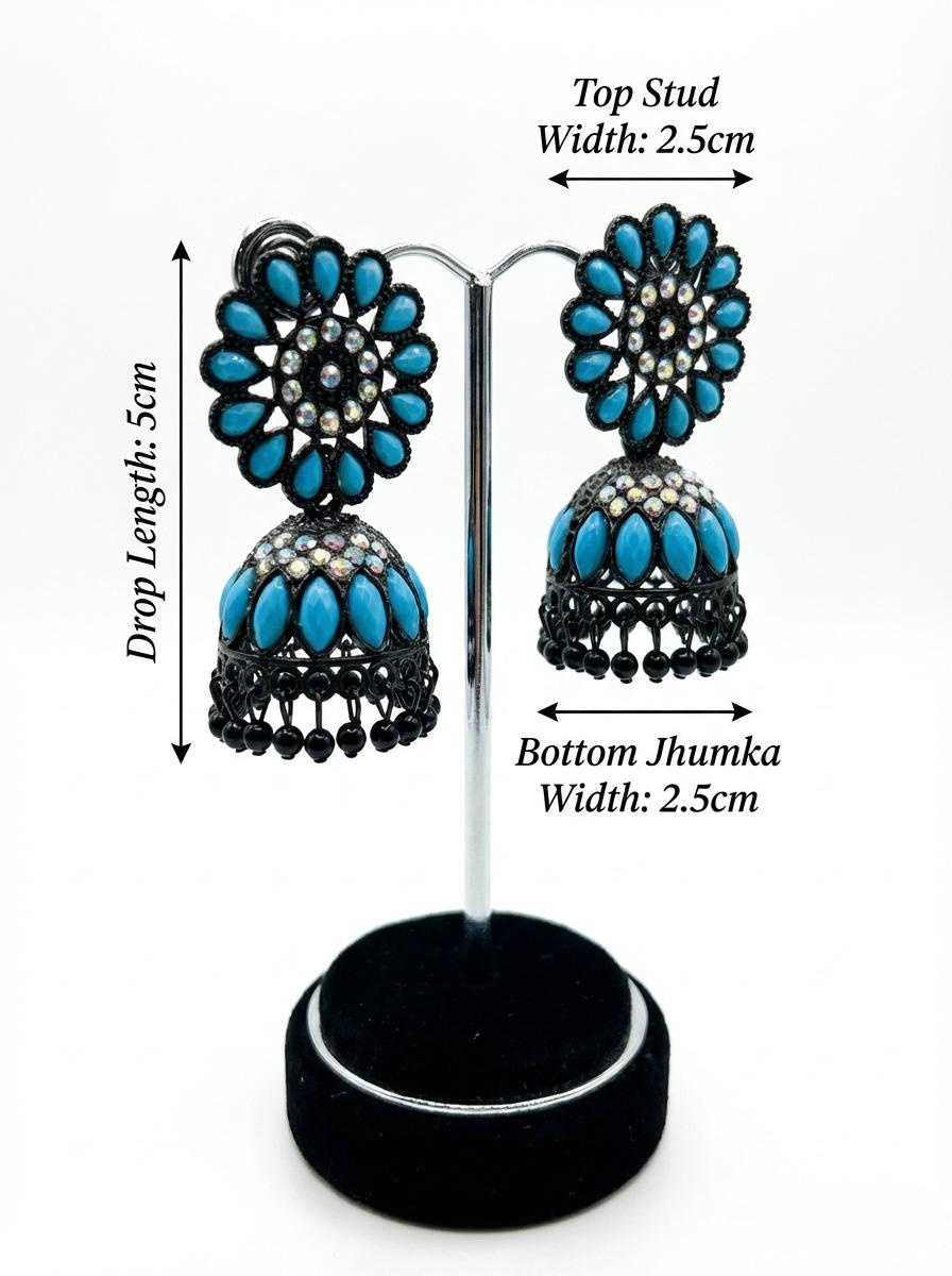 Stylish black brass jhumka earrings featuring a bold blue floral stone stud and matching blue stone accents on the jhumka base.
