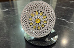 Sunflower Splendor Diamond Statement Ring by Famaza Couture — Fancy Yellow center stone with marquise and pear-cut white diamonds, displayed on stand against black marble surface, luxury floral halo cocktail ring.