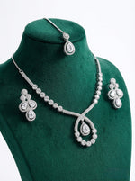 The American diamonds bridal jewellery set including necklace, earrings and maang tikka is displayed on the dummy.