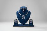 The American diamonds bridal jewellery set including necklace, earrings and maang tikka with purple colour central cubic zirconia stones