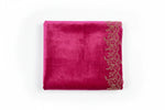 A Hot pink colour velvet fabric shawl with gold colour nano beads embellishments and intricate floral patterns by Famaza Couture