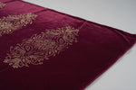 The Maroon colour velvet fabric shawl with gold colour nano beads embellishments and intricate floral patterns.