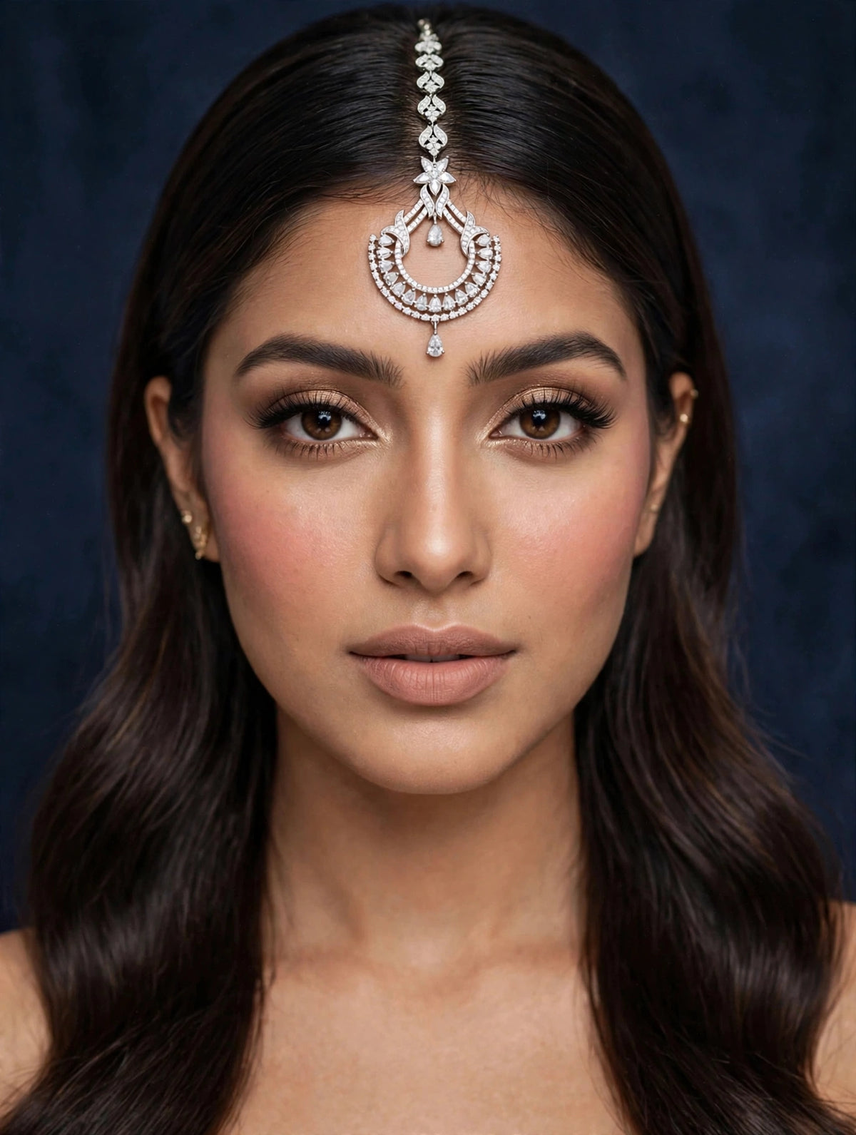 The Siya Contemporary Luxe Cubic Zirconia Maang Tikka — silver-toned intricate crescent design with flower motif, round & pear-cut cubic zirconia stones, bridal forehead jewelry, premium Pakistani Indian wedding accessory.