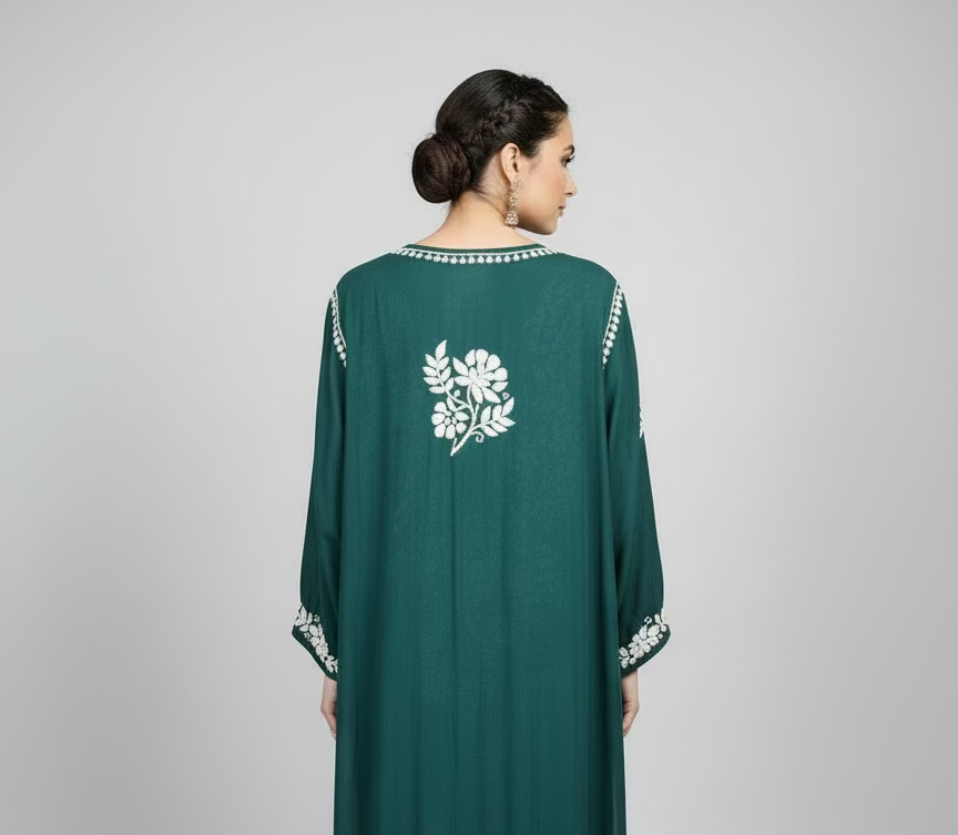 The back side design is showing in this hanging bottle green 46 inches long kurti.