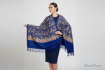 A blue colour pashmina scarf with Kashmiri embroidery in a floral pattern, featuring tassels on the ends.