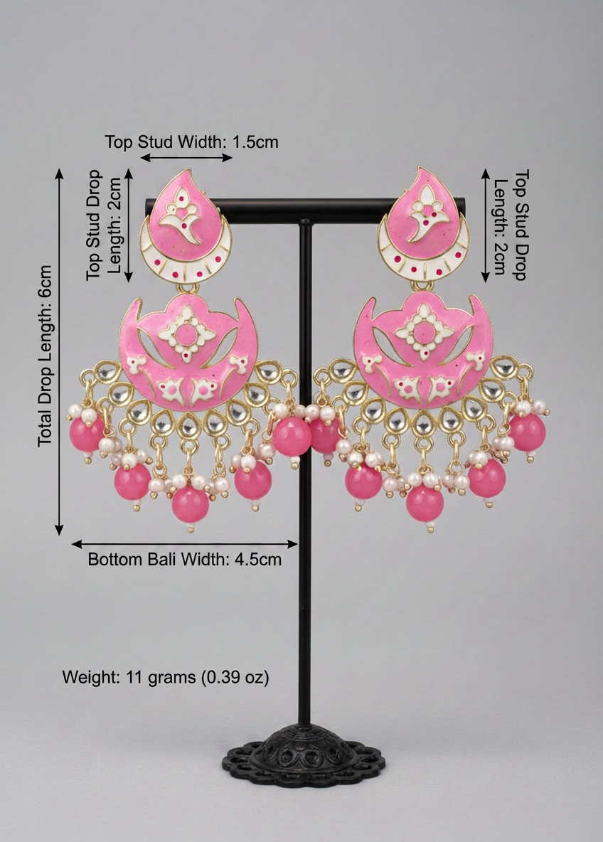 The enamel painted pink colour Pair of earrings displayed on a stand.