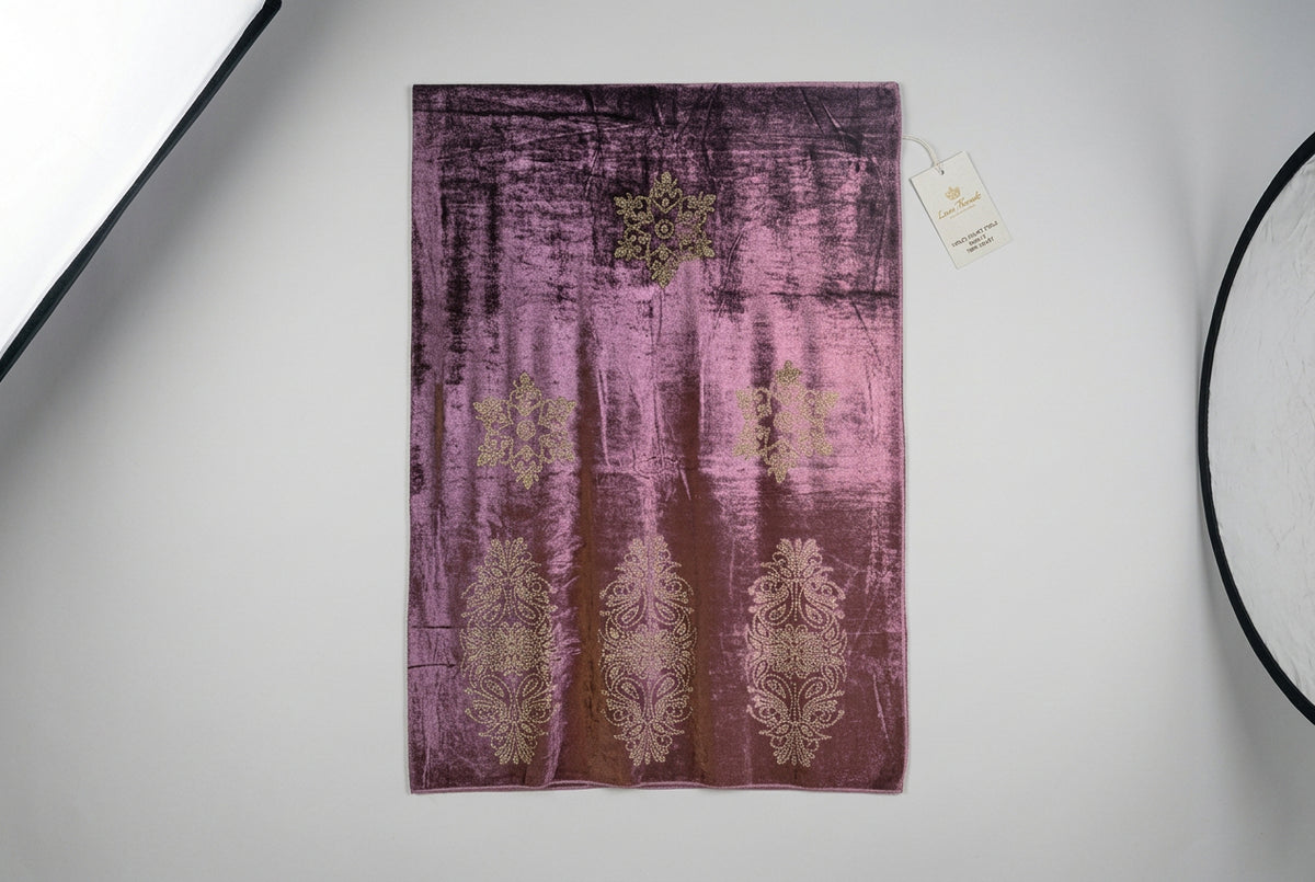The violet purple velvet stole with Swarovski crystal embellishments and intricate floral patterns by Famaza Couture.