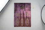 The violet purple velvet stole with Swarovski crystal embellishments and intricate floral patterns by Famaza Couture.