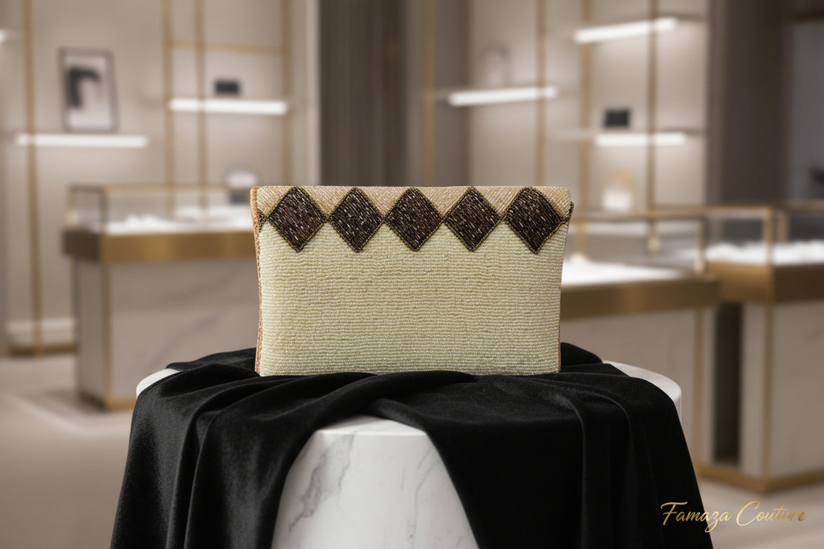 The white clutch bag with multi-coloured nano glass beads patterns, hand embroidered, displayed outdoors.