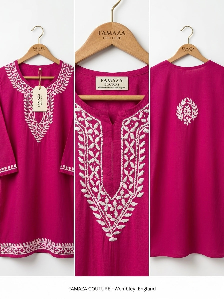 Three views of a bright magenta pink tunic top with white embroidery, hanging on wooden hangers. The center view shows the front with detailed white floral embroidery around the neckline, while the left view shows the side and hem, and the right view shows the back with a small white embroidered motif.