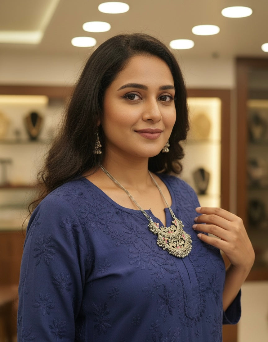 Traditional Indian pendant styled with a white linen shirt for a modern look