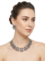 Vintage oxidised silver elephant motif necklace set on model for Indian festival wear in London UK