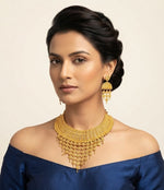 Posh model wearing the Wareesha Luxe Heritage Filigree Statement Choker Set by Famaza Couture with intricate gold-plated detailing.