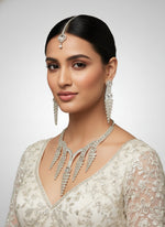 White American diamonds stones with white centre stones necklace , earrings and maang tikka by famaza couture