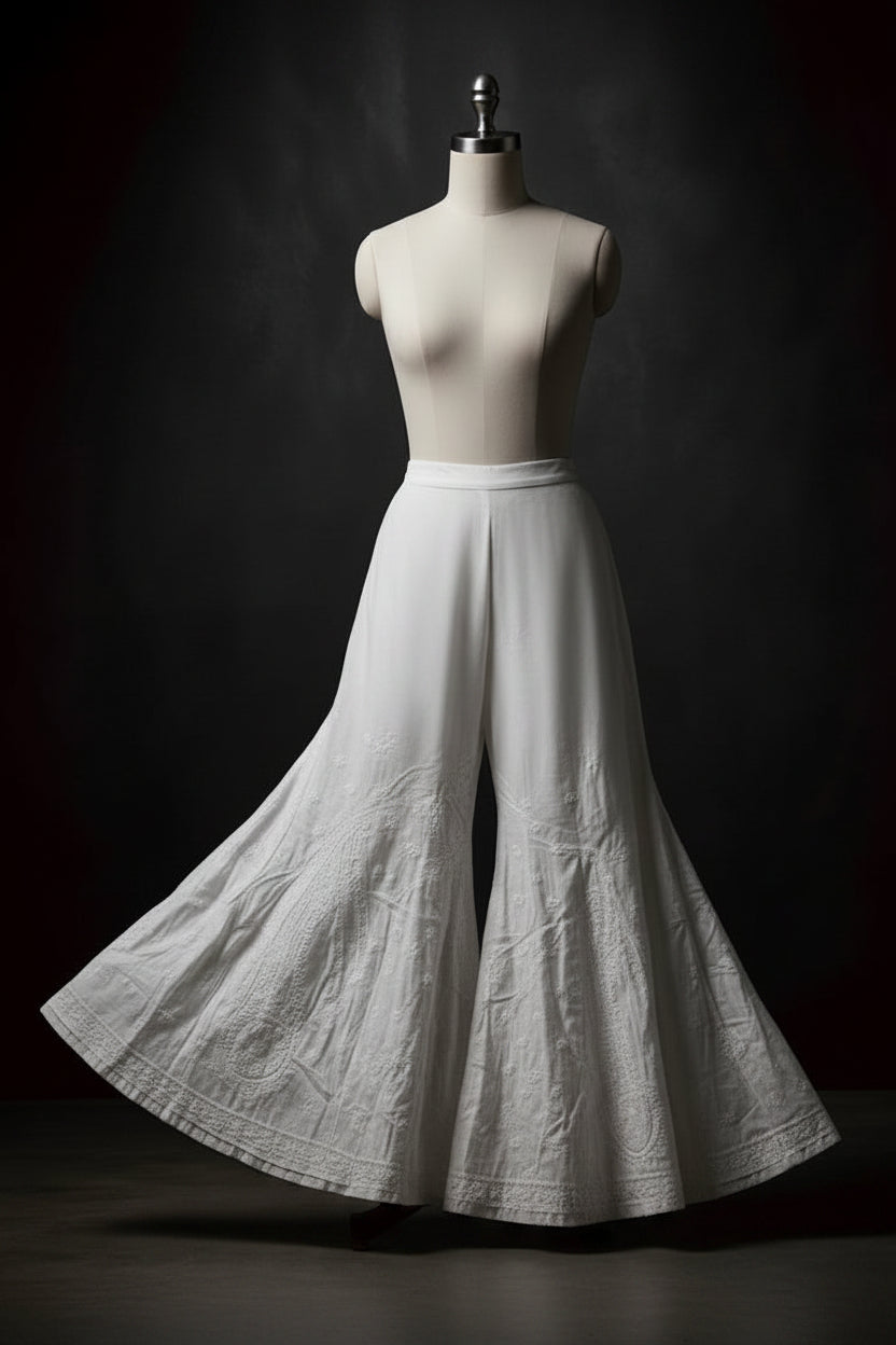 Classic white cotton flared sharara featuring delicate embroidery, traditional Indian/Pakistani style