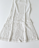 White pure cotton sharara featuring fine white thread Bakhiya embroidery, intricate antique gold Kaamdani detailing, flared silhouette, lightweight fabric – ideal for festive, casual and traditional wear.