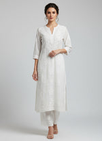 White colour modal fabric tone to tone hand embroidered kurti and trousers. Kurti is 46 inches long