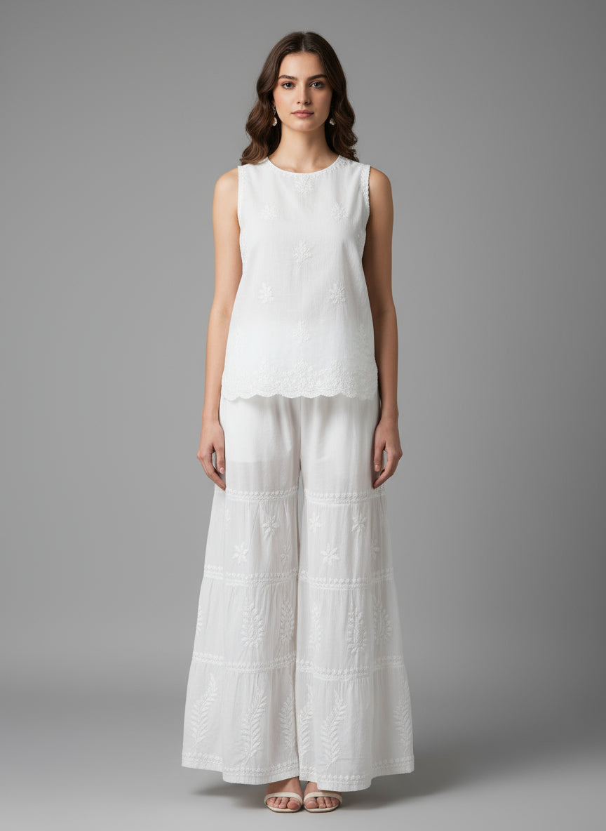 White embroidered pants on a mannequin in a store setting