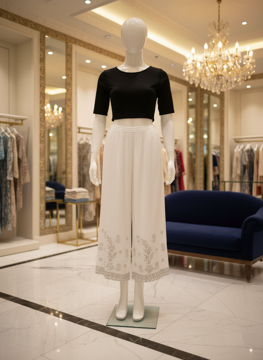 White reyon fabric hand embroidered trousers by famaza couture