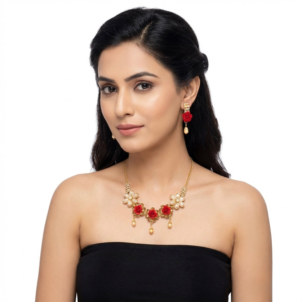 Woman wearing a red and gold necklace and matching earrings.