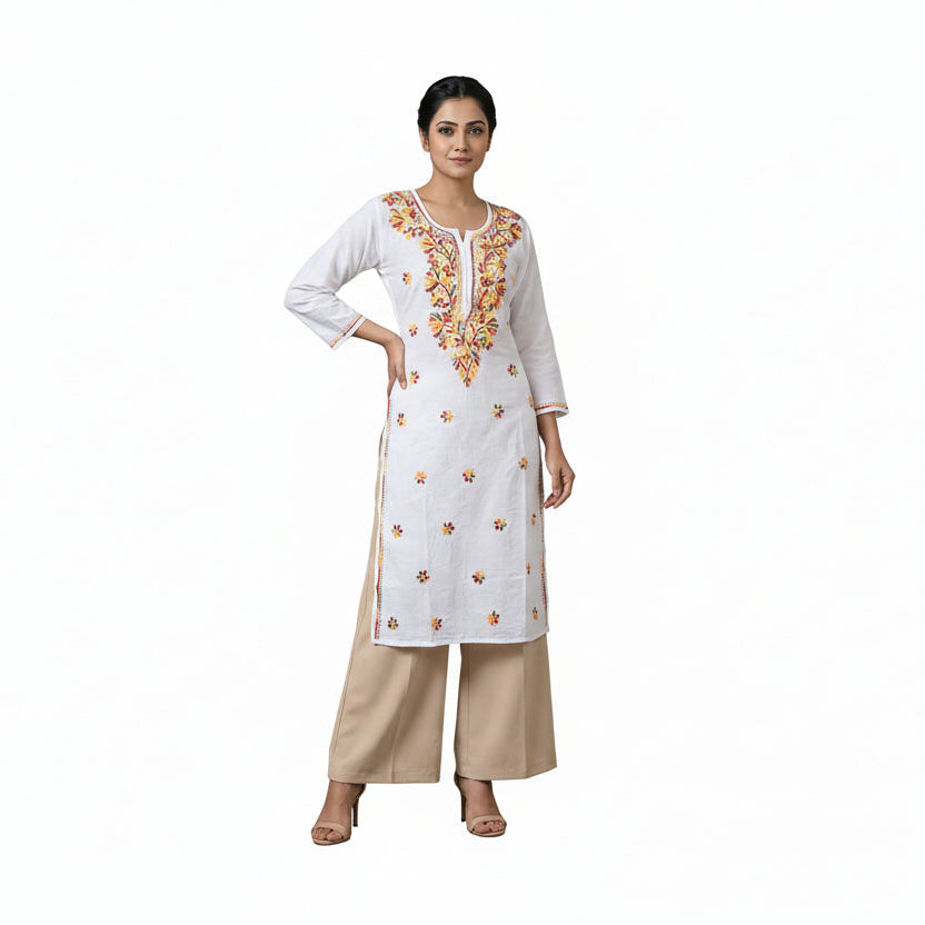 Woman wearing a white embroidered kurta with beige pants against a neutral background