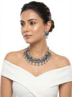 Young woman wearing the Sienna artisanal multicolour silver oxidised choker and drop earrings, styled for an elite evening jewellery look.