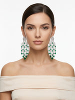 Stunning silver-plated grand cascade statement earrings showcasing a crown-shaped stud and multiple tiers of dangling emerald green and clear CZ pear drops.