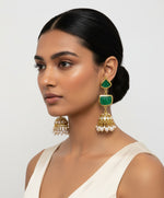 A pair of gold-plated sugar stone drop jhumka earrings with pink stones and white pearl-like accents.