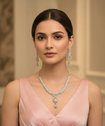 a rhodium plated brass jewellery necklace and earrings with American diamond and semi-precious stones by famaza couture