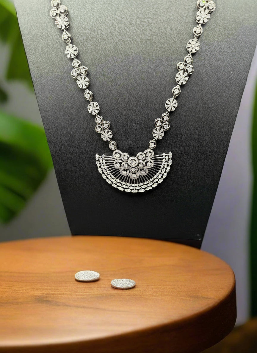 black plated floral necklace and earrings set with white American Dimond stones by famaza couture