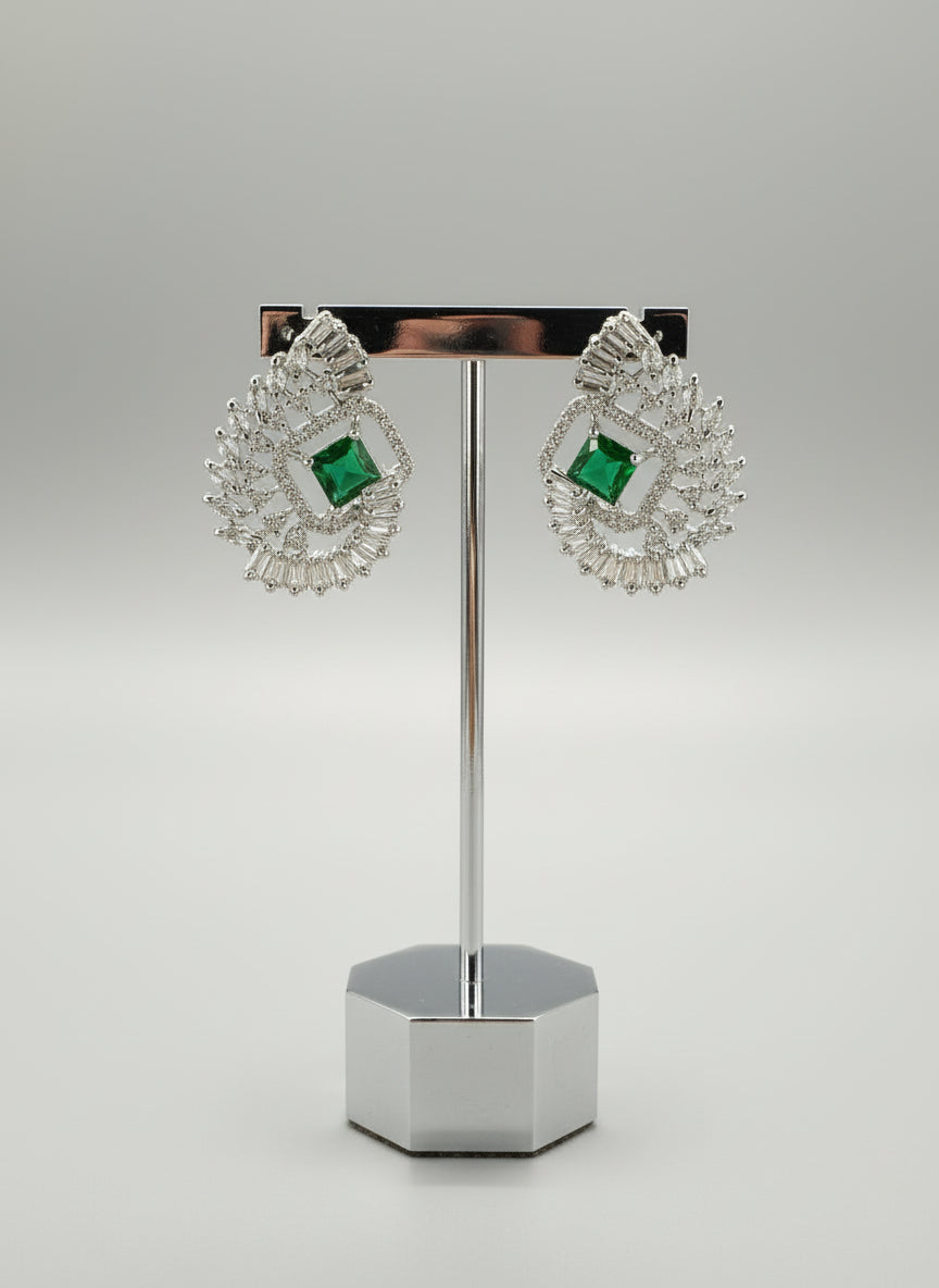 bottle green centre stone earrings, featuring a geometric design with intricate detailing, displayed on a mannequin. Party wear set.