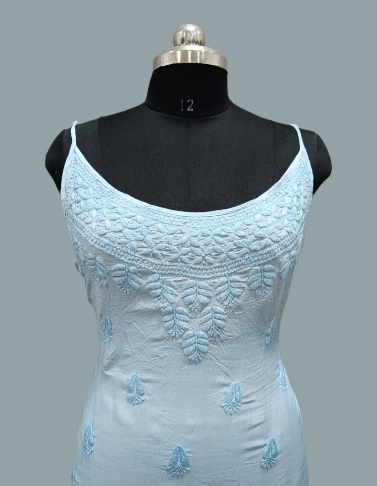 Close up of Chikankari cotton slip dress showing detailed embroidery