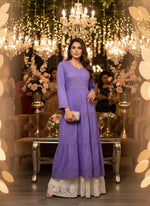 Model wearing a chikankari dobby cotton long flared dress in Purple colour with wide flared trousers
