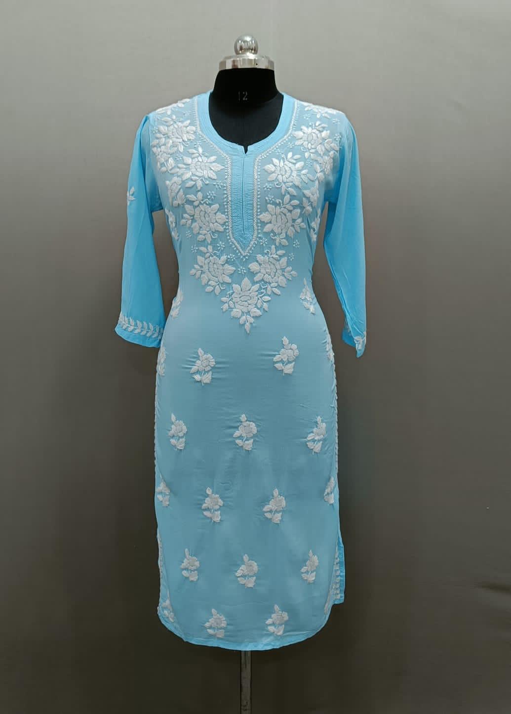 Chikankari kurti with Ghass Patti embroidery on a mannequin in sky blue colour