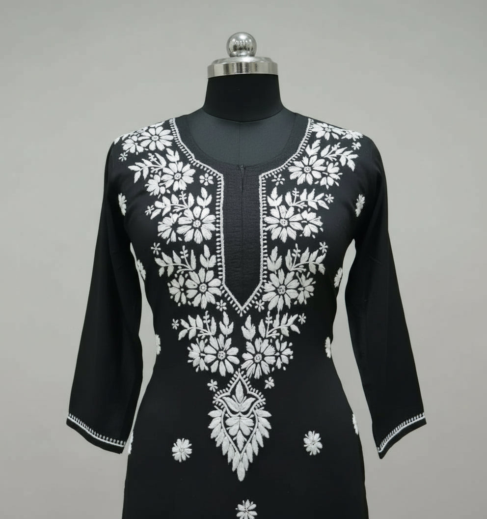 close up of black modal kurti with white hand embroidery in a Ghass Patti pattern and booti work.