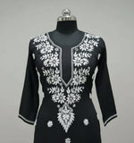 close up of black modal kurti with white hand embroidery in a Ghass Patti pattern and booti work.