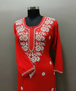 close up of red modal chikankari kurti with white hand embroidery in a Ghass Patti pattern and booti work.