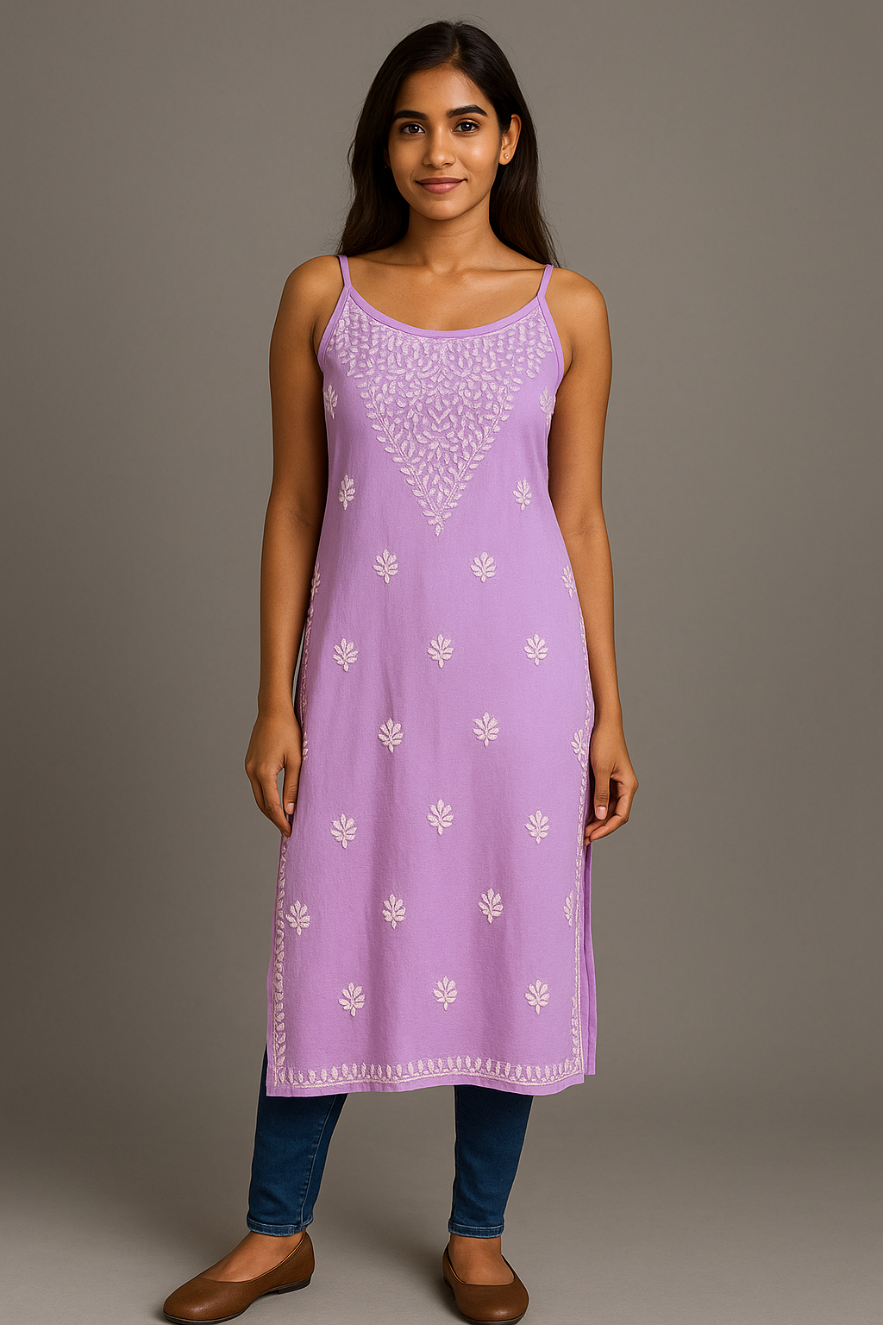Model wearing Chikankari slip dress kurti in lavender colour with blue jeans and brown shoes