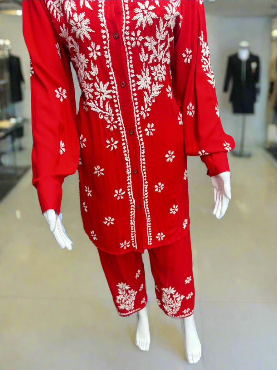 close up of chikankari embroidered cord set displayed on a mannequin, consisting of a front-open shirt and matching trousers.