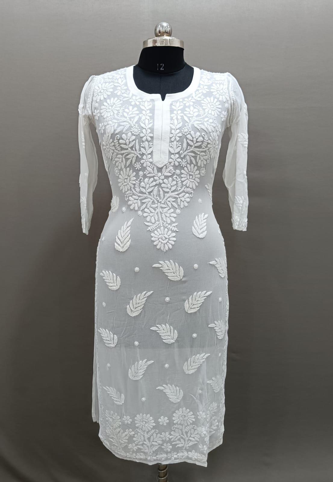 A long, white viscose kurti with hand-embroidered Chikankari patterns displayed on a mannequin.