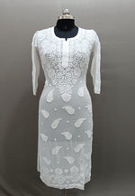 A long, white viscose kurti with hand-embroidered Chikankari patterns displayed on a mannequin.