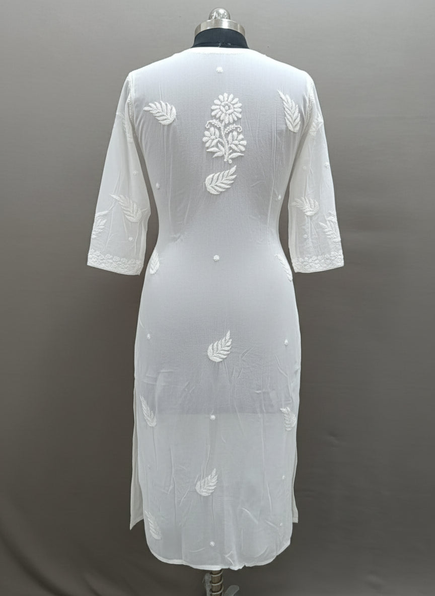 Chikankari kurti viscose rear view in white model is wearing and posing in this a long, white viscose fabric kurti with ghasspati hand-embroidered Chikankari patterns with white viscose fabric flared gharara by Famaza Couture London brand