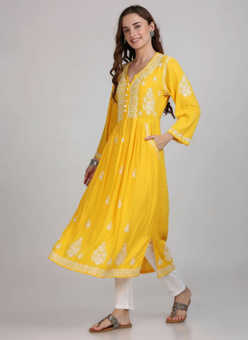 yellow chikankari kurti with pockets, side view