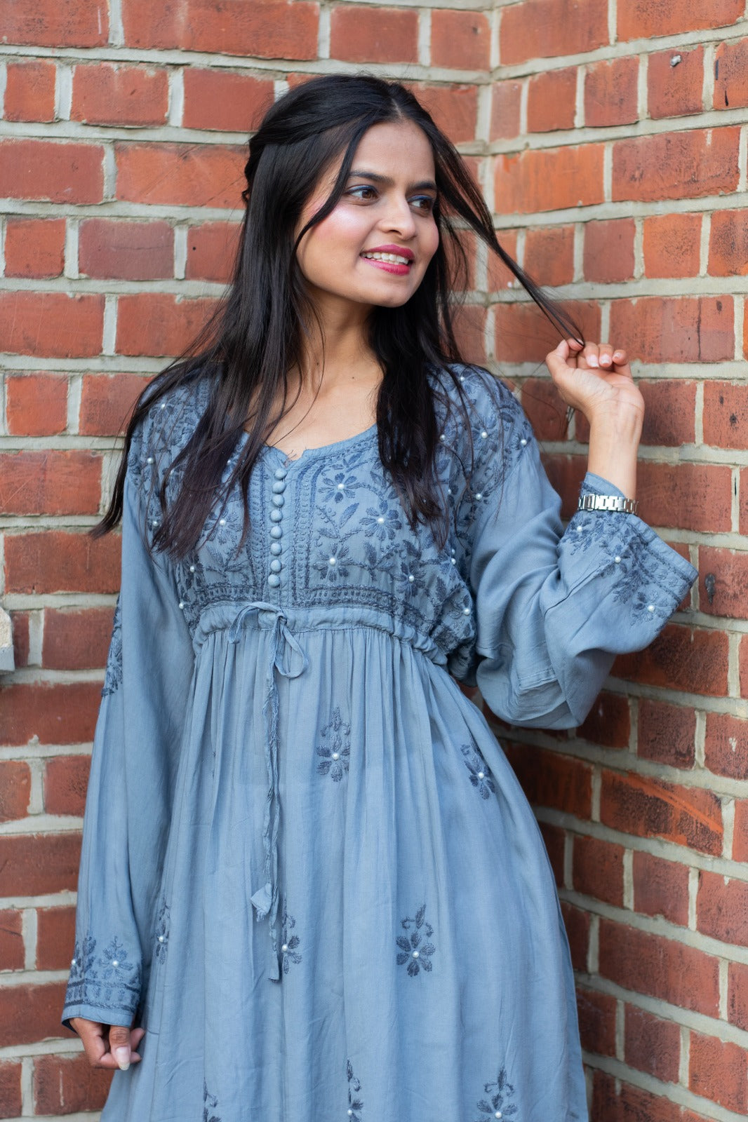 model wearing chikankari short frock kurti